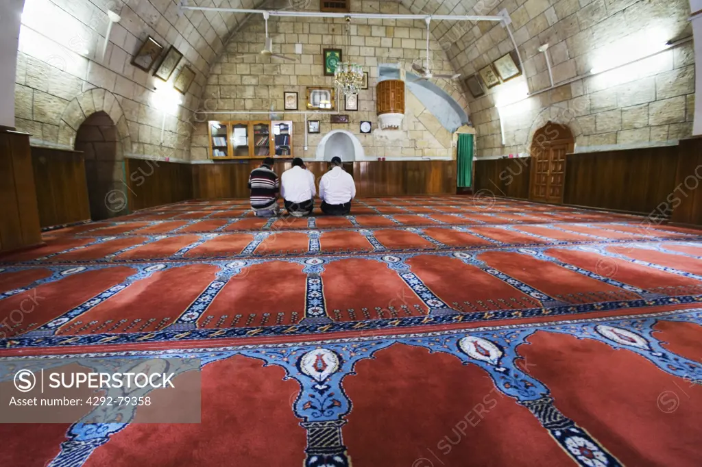 Turkey, Urfa, turkish pilgrims praying at the chapel of the Abrham's cave, the birthplace of the Prophet Abraham according to a legend