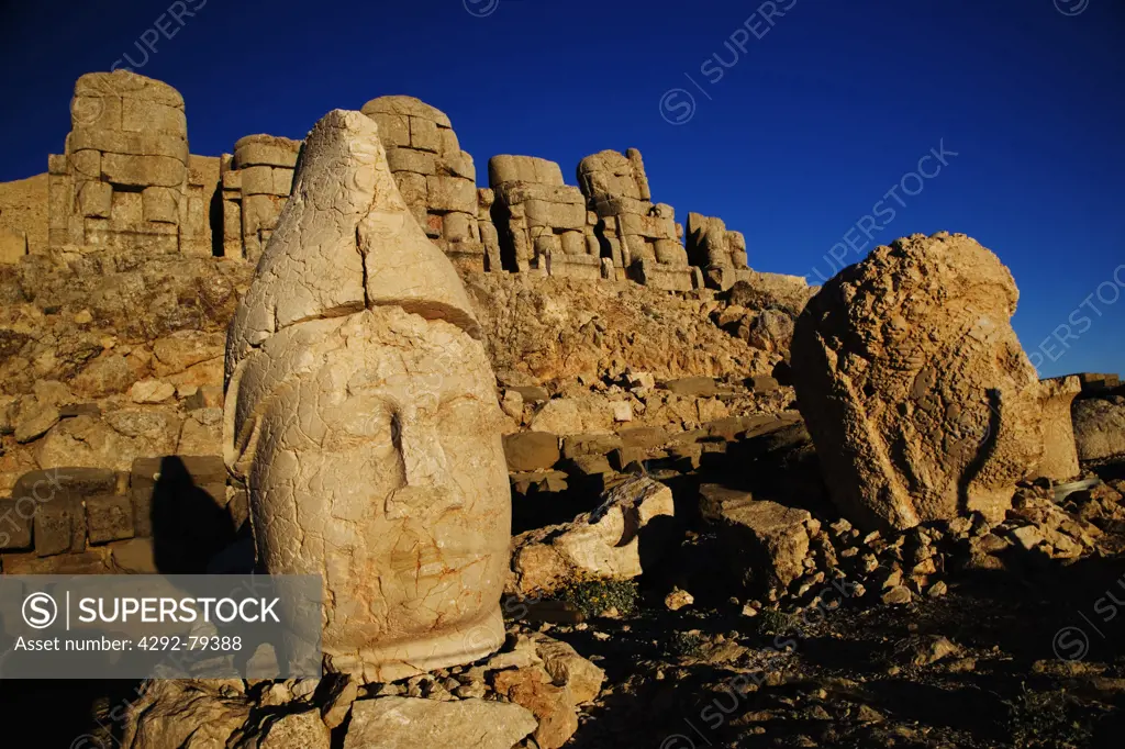 Turkey, Mount Nemrut Dagi, East terrace at sunrise, the colossal heads are, from L-R, Antiochus I and the Goddess Tyche