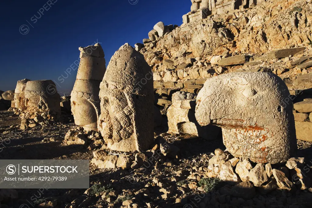 Turkey, Mount Nemrut Dagi, East terrace at sunrise, the colossal heads are, from L-R, Antiochus I, Tyche, Zeus-Oromasdes, Apollon-Helios and an eagle