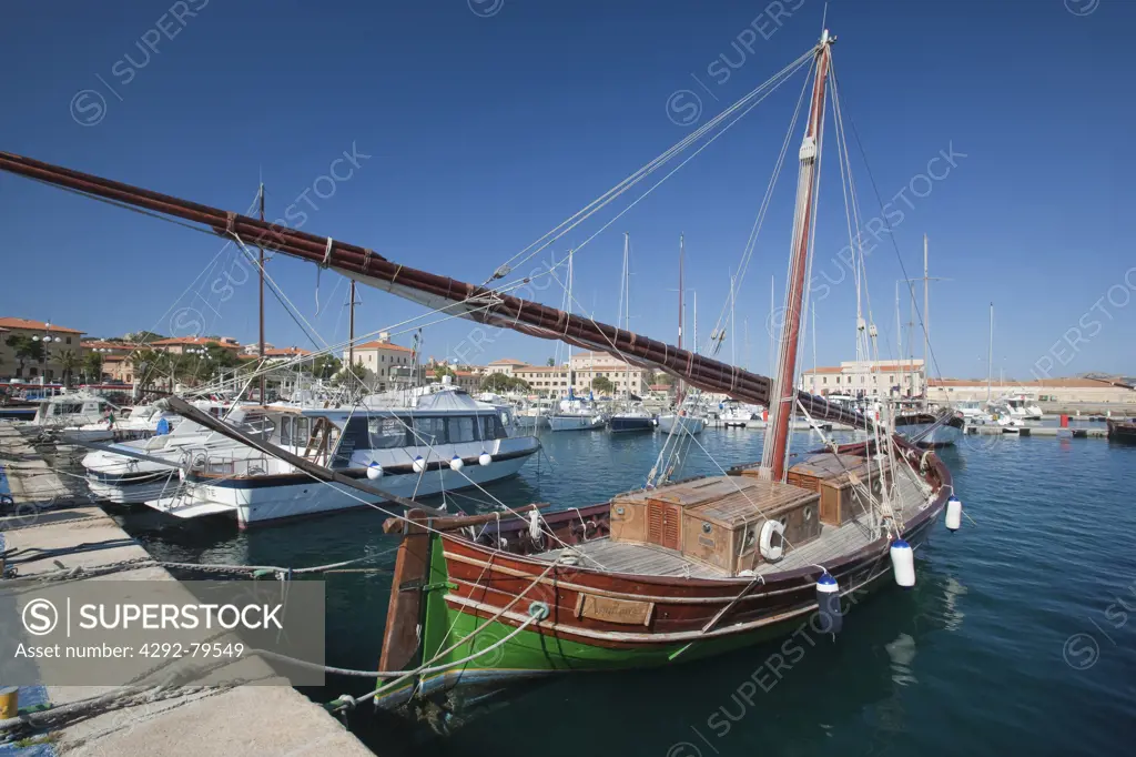 Italy, Sardinia, Archipelago La Maddalena National Park, La Maddalena island, Vintage boats at La Maddalena harbou