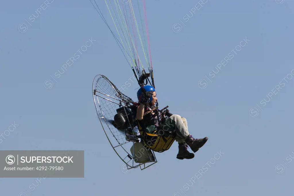 Low angle view of paramotor in air