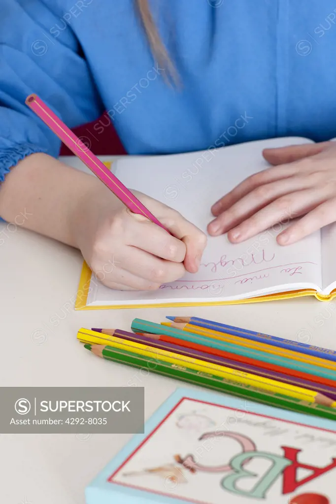 Girl hands with pencil