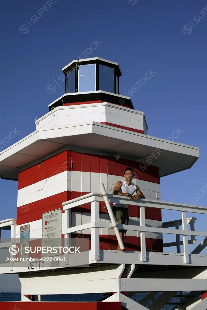 USA, Florida, Miami, Man standing on life guard tower