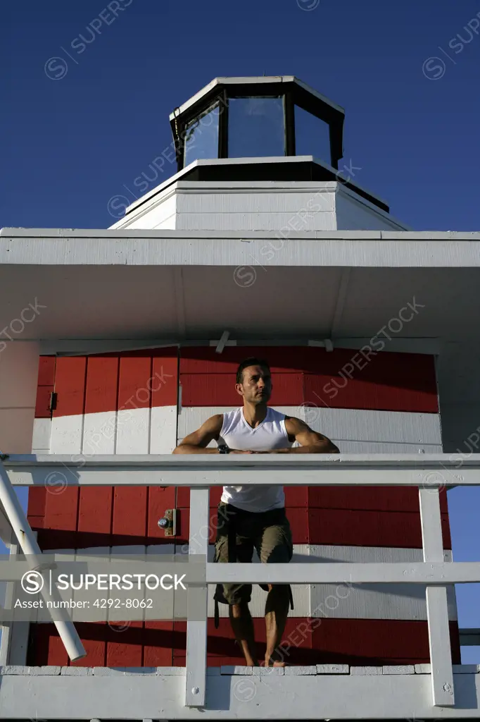 USA, Florida, Miami, Man standing on life guard tower