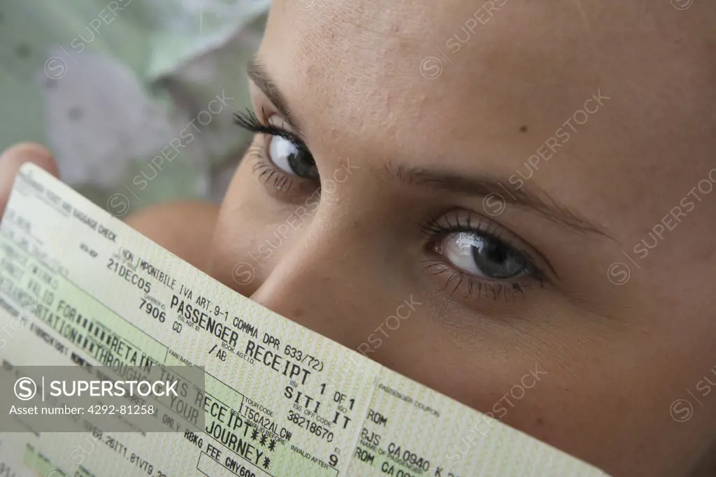 Woman showing her airplane ticket