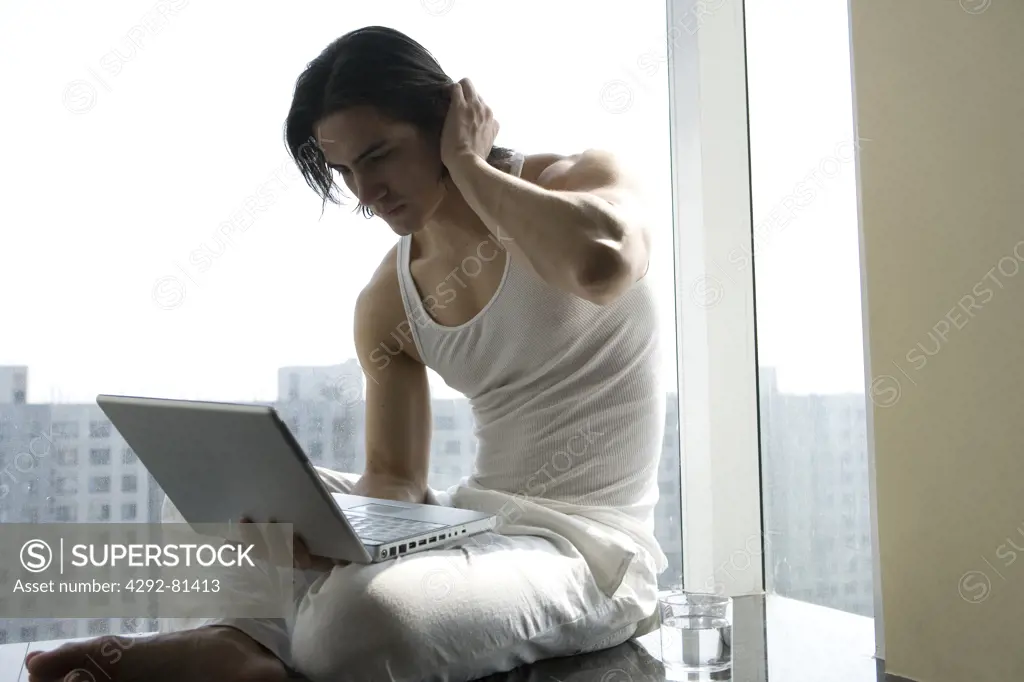 Young man in front of laptop