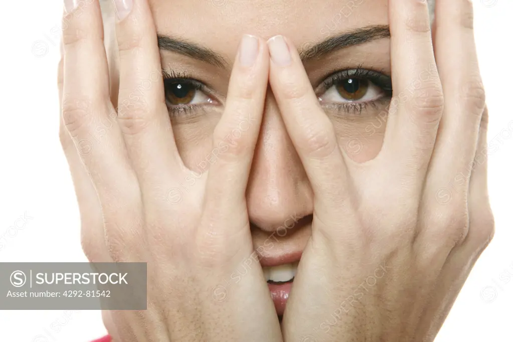 Woman with hands covering face