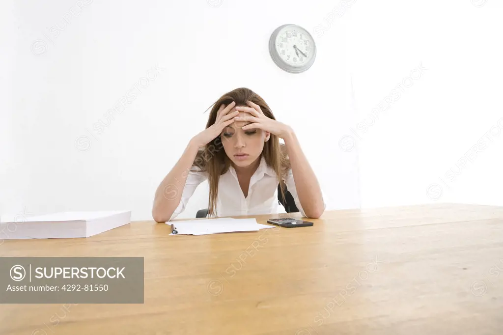 Stressed businesswoman in office