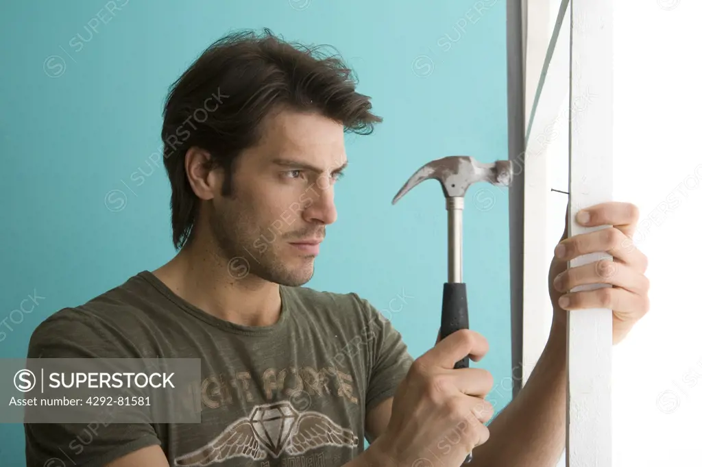 Man using hammer