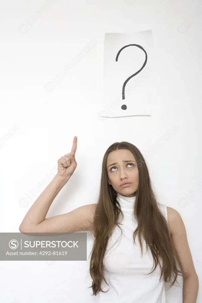 Woman in front of a question mark