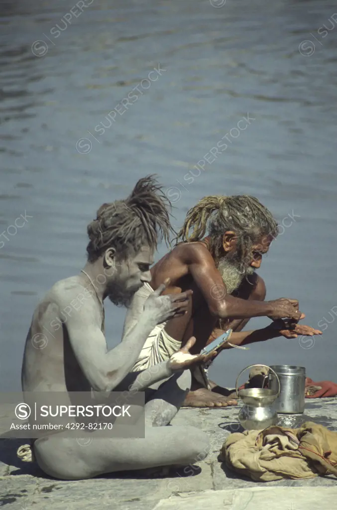 Nepal, Kathmandu. Sadhu men on Bagmati river