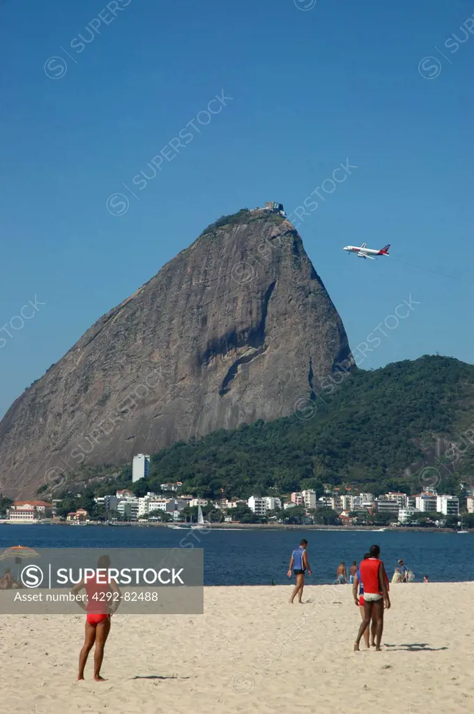 Brazil, Rio de Janeiro, Brazilians Playing Soccer at Praia do Flamengo the Pao de Acucar Sugar Loaf on the Background