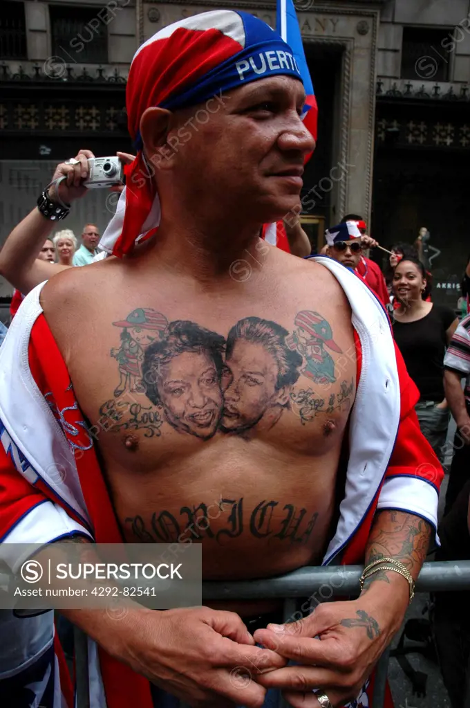 USA, New York, New York City, Tattooed Man at the Puerto Rican Parade along the Fifth Avenue
