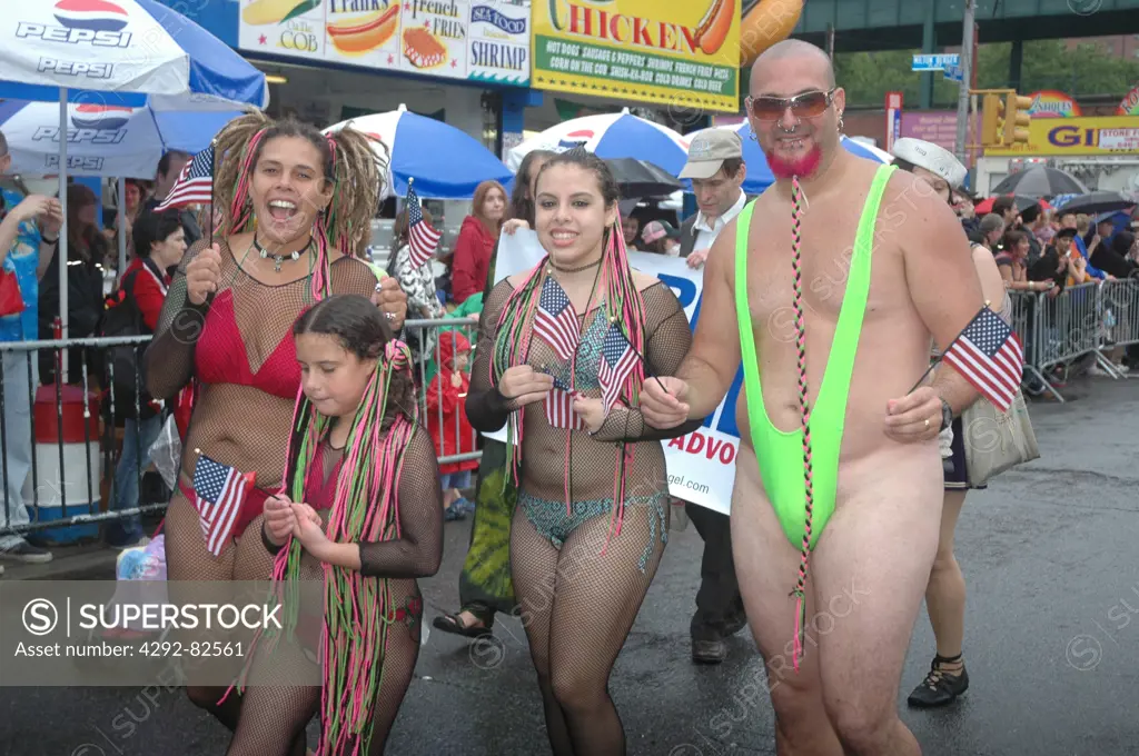 USA, New York City, Coney Island, family during  Mermaid Parade