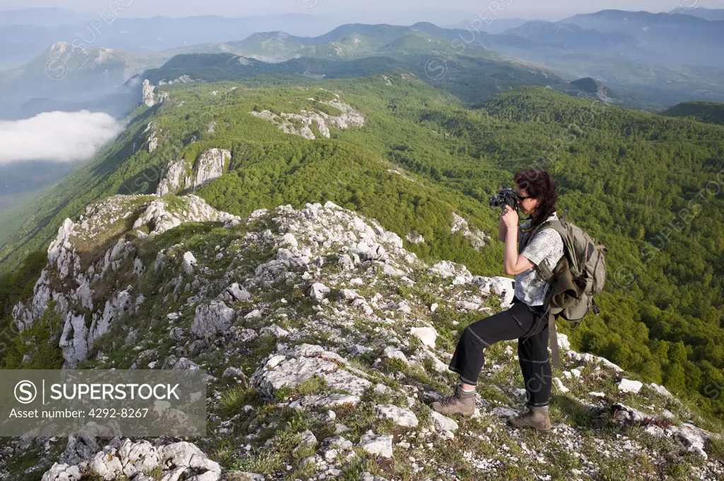 Italy, Campania, Cilento National Park, Alburno Mountains, Hiker Photographing
