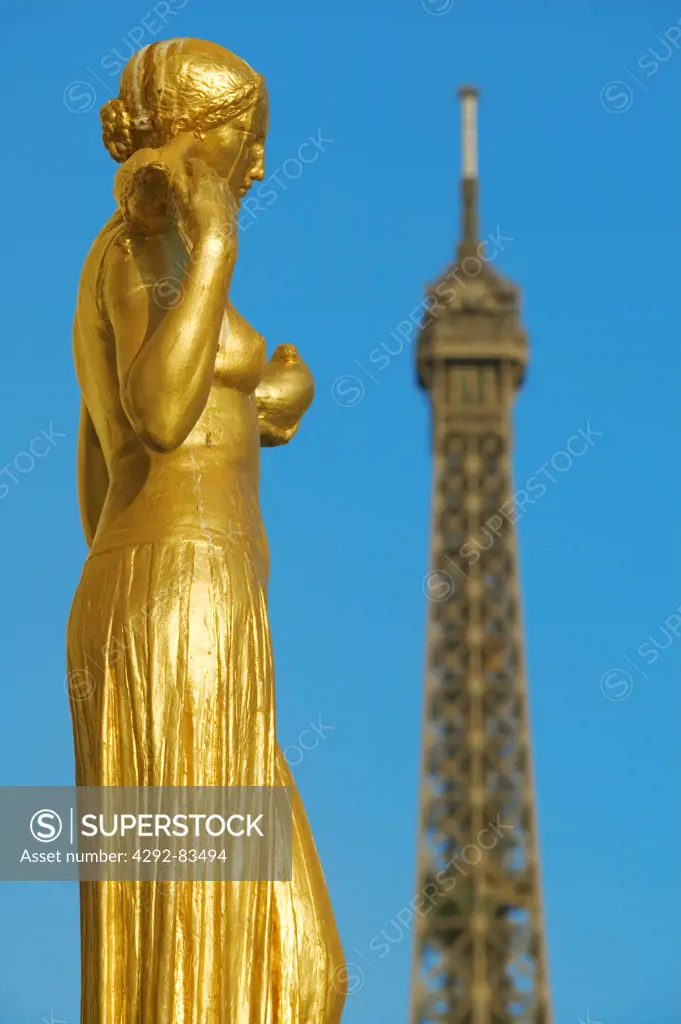 Golden statues at the Palais de Chaillot and the Tour Eiffel, Paris France