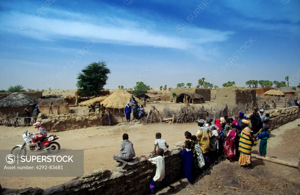 Africa, Mali, village, people looking at motocross riders during competition