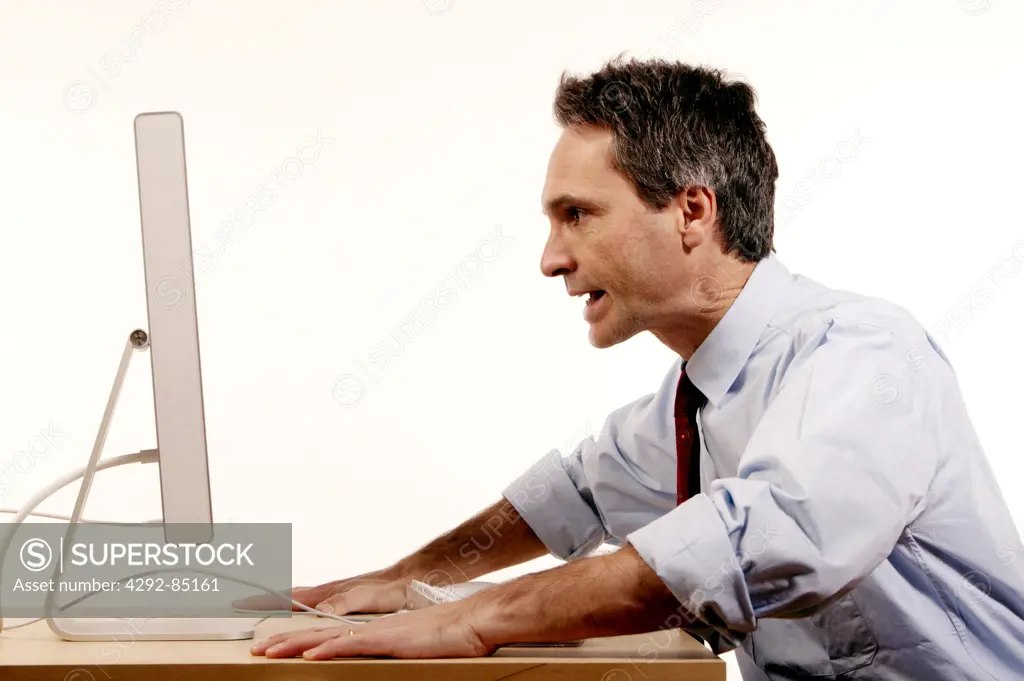 Stressed businessman in front of computer