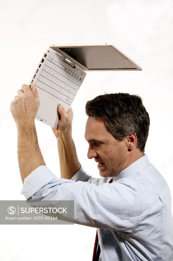 Man about to destroy his laptop