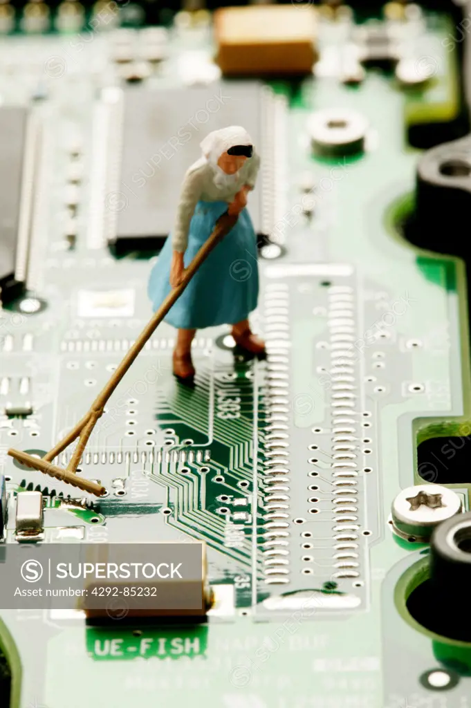 Toy worker on circuit board, detail