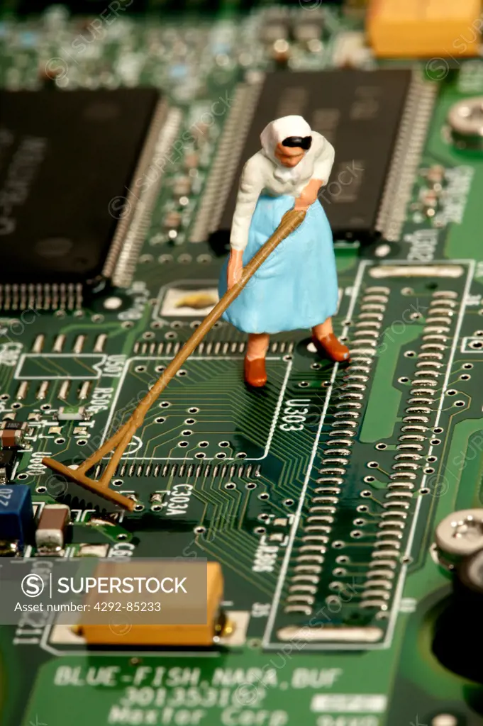 Toy worker on circuit board, detail