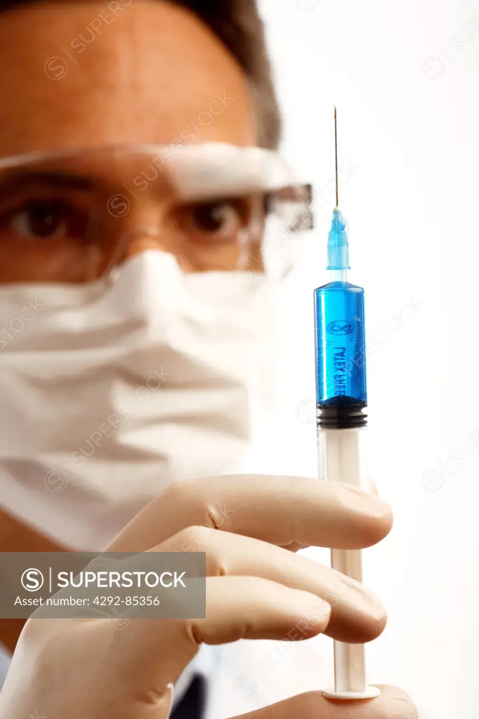 Man holding a syringe