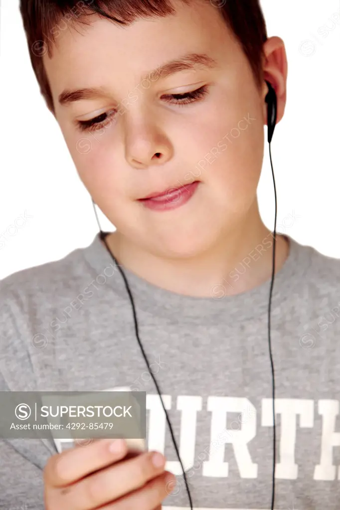 Boy listening to music with ,MP3 player