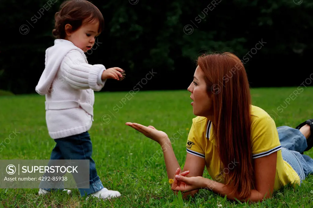Mother in playground with daughter