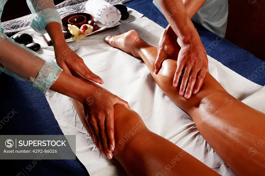 Woman getting legs massage
