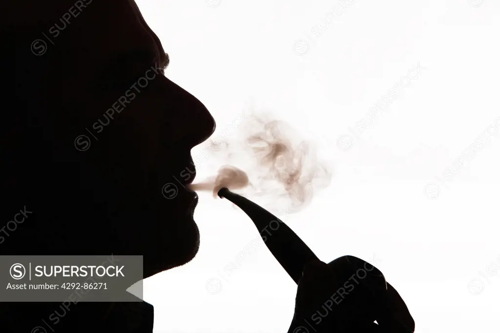 Man profile smoking pipe