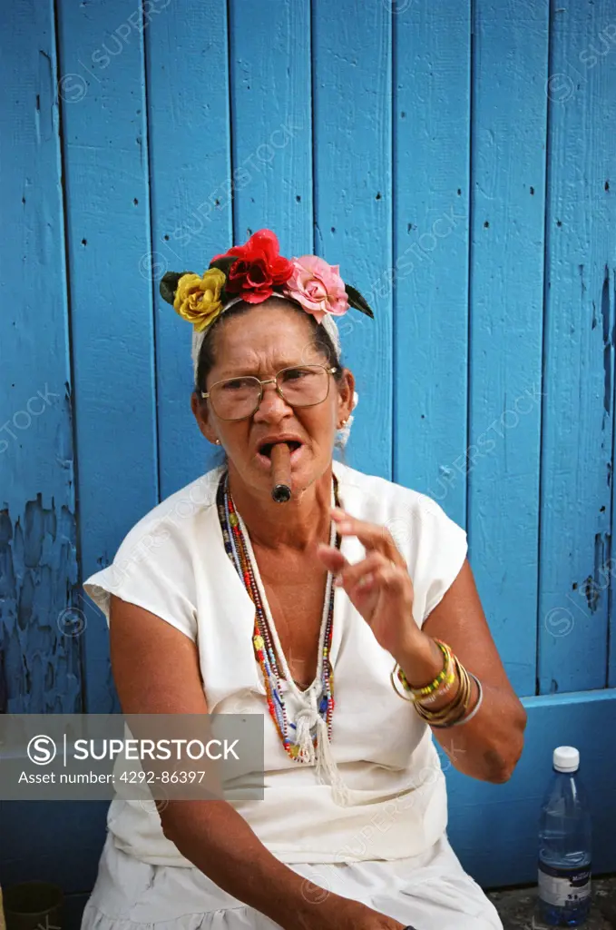 Carribean woman smoking cigar