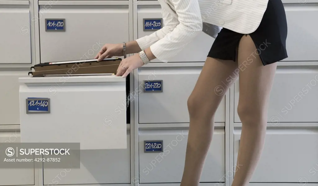 Secretary looking at files