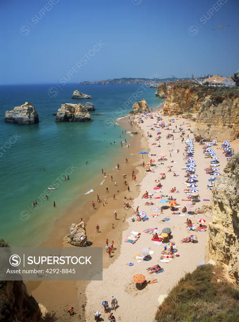 Portugal, Algarve, rows of parasols on Praia da Rocha