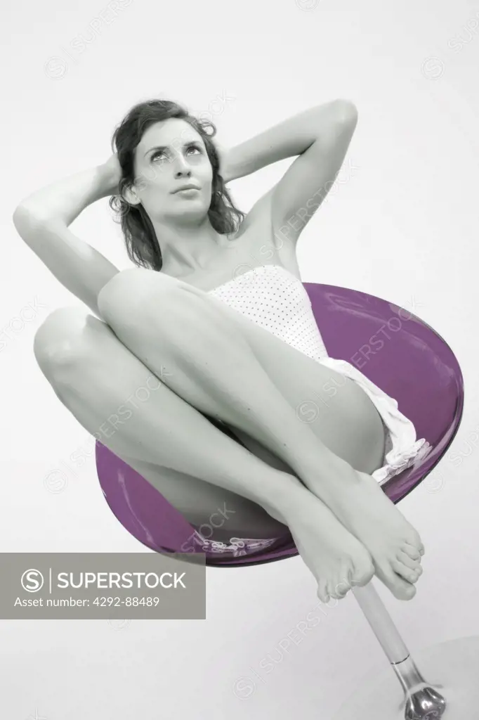 Woman sitting on a purple chair