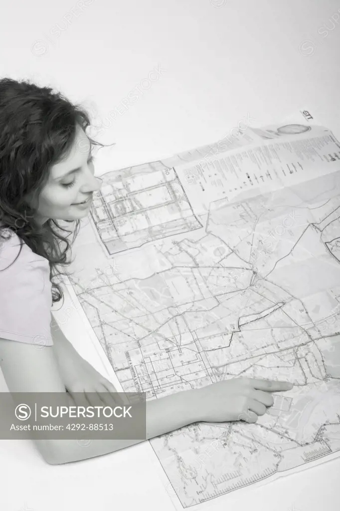 Young woman examining map