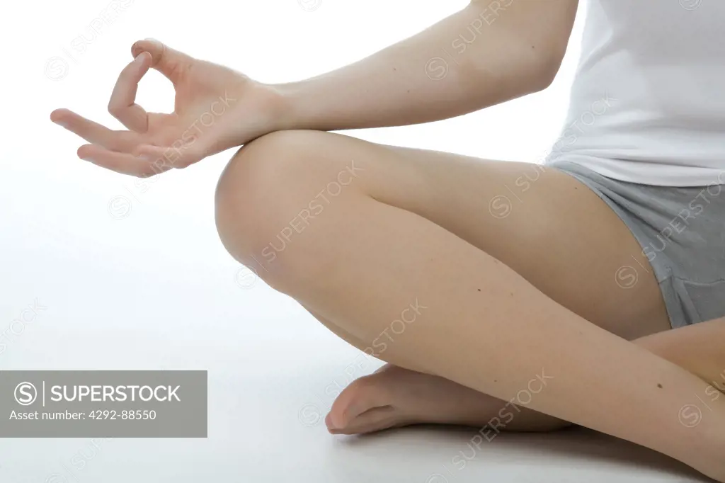 Detail of woman doing yoga
