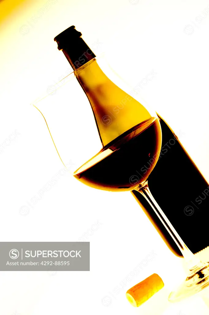 Close up of a bottle and a glass of red wine
