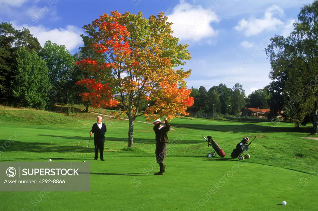 Golf players on green near Stockholm in Sweden