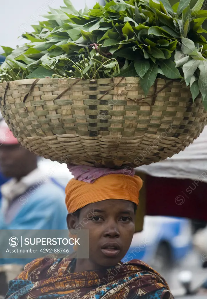 Africa, Burundi, woman carrying a basket on her head