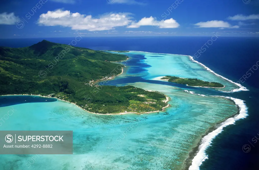 Aerial view of Huahine Island with surrounding coral reefs and lagoons in French Polynesia