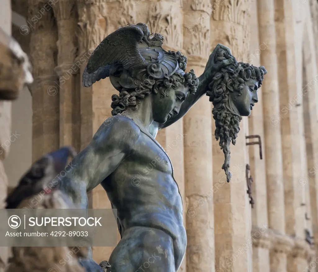 Italy, Tuscany, Florence, Piazza della Signoria, Loggia dei Lanzi. Cellini Bronze statue of Perseus.