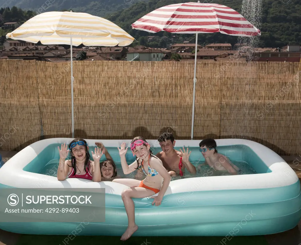 Group of children in inflatable swimming pool