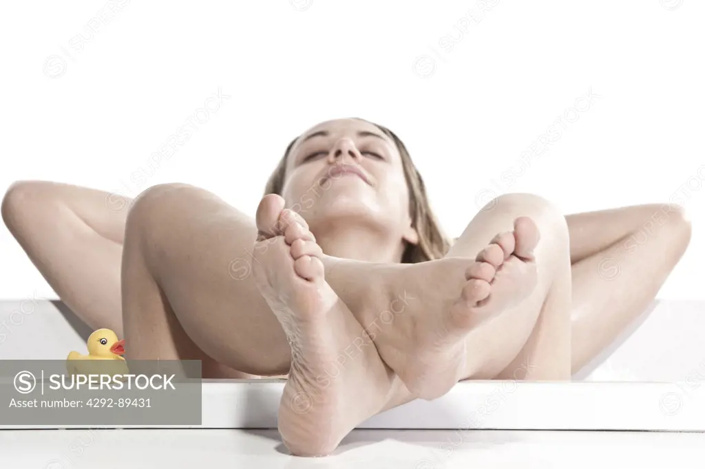 Close up of woman relaxing in bathtub