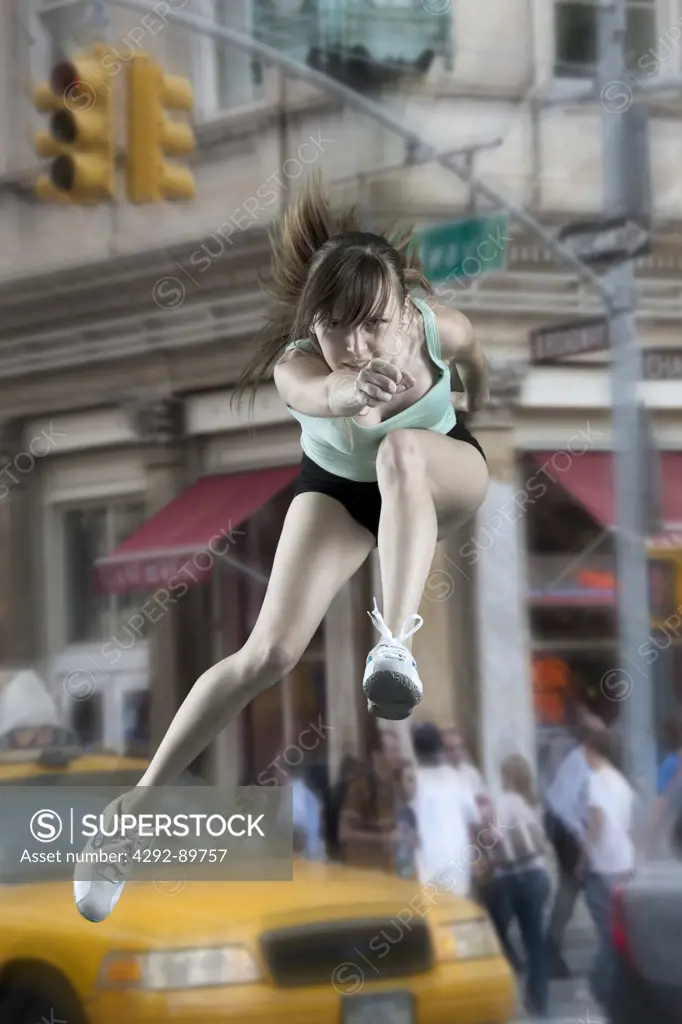 USA, New York City, woman leaping