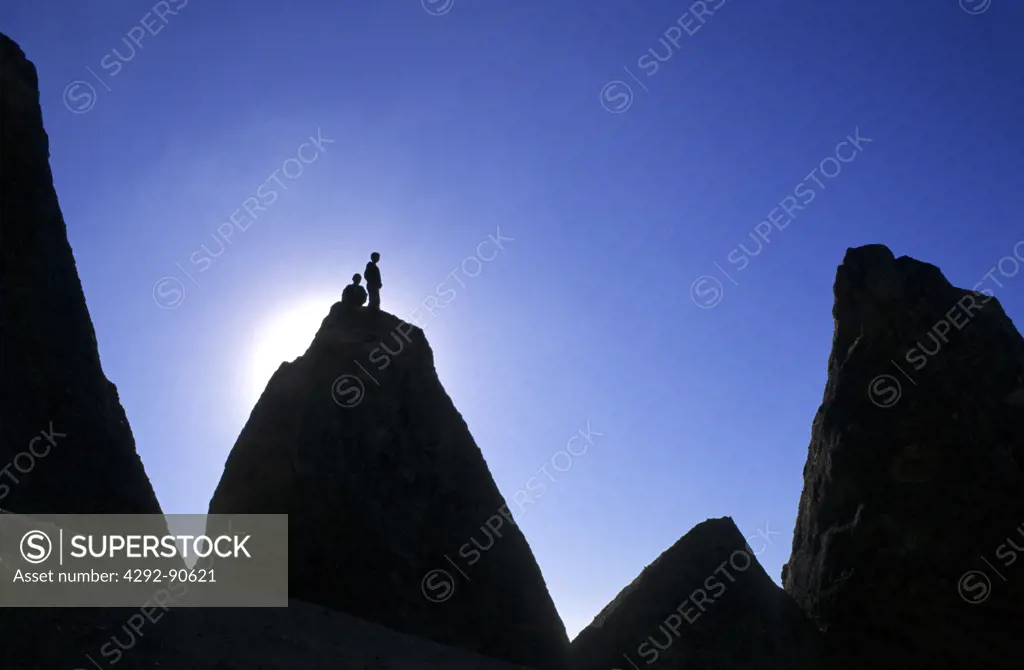 Turkey, Cappadocia, people on cliff