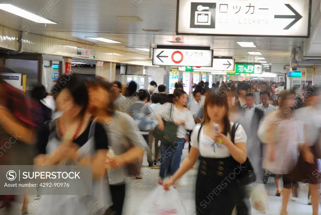 Japan, Tokyo, people walking at railway station