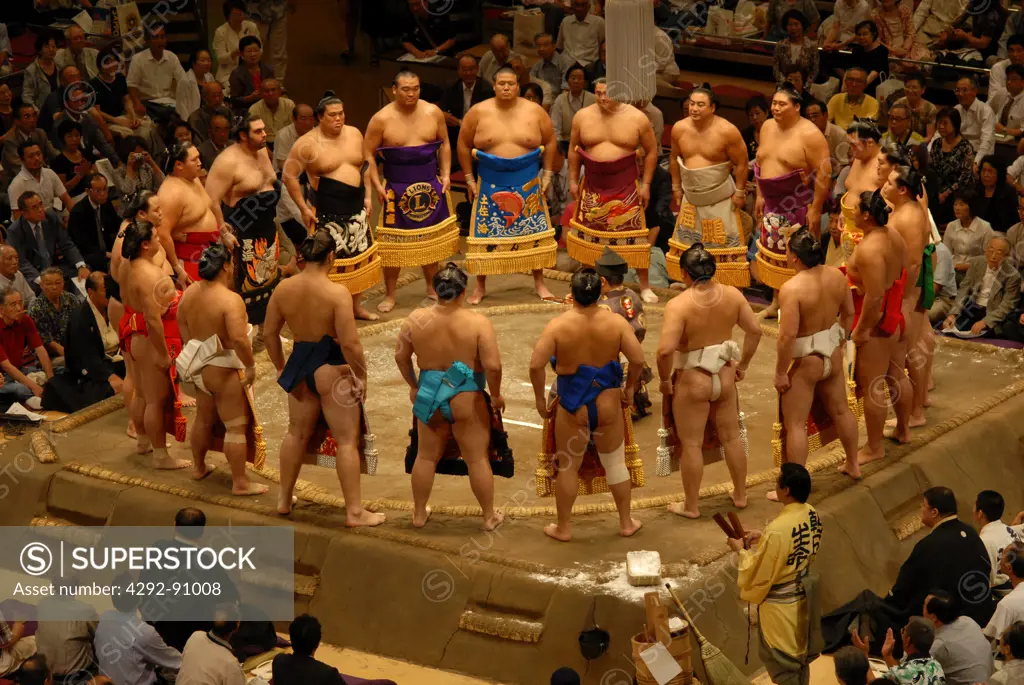 japan, Tokyo, pre fight sumo wrestling ceremony of competitors parading around ring in traditional costume