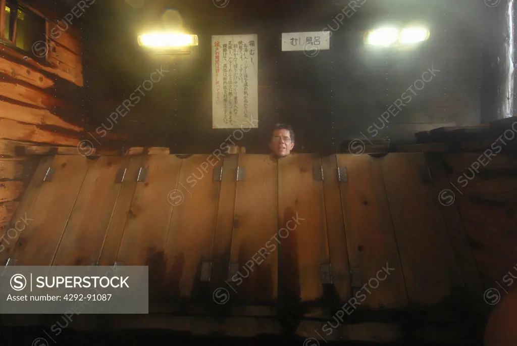 Tourist having a steam bath at Goshogake Onsen, Akita Prefecture, Honshu, Japan
