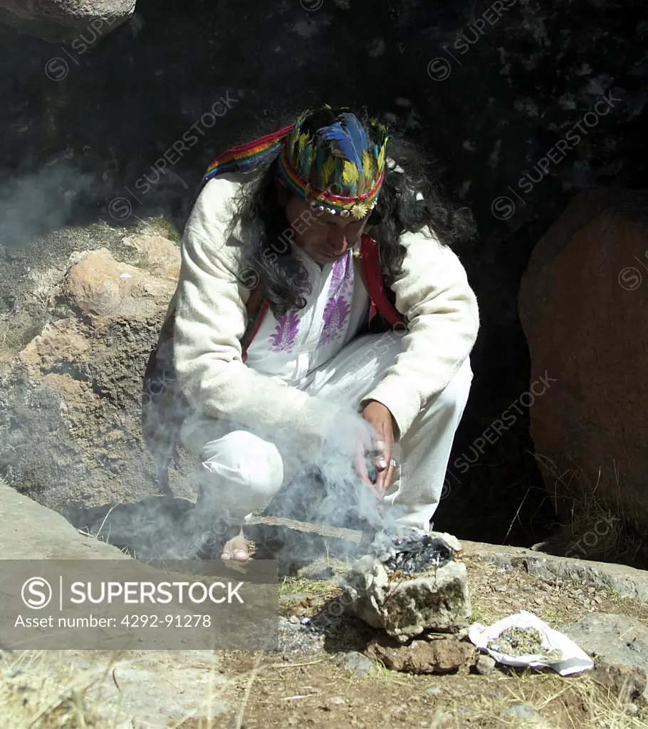 Peru, Cuzco, Sacsayhuaman Inca ruin, priest celebrating a shamanism during the mass in a cave