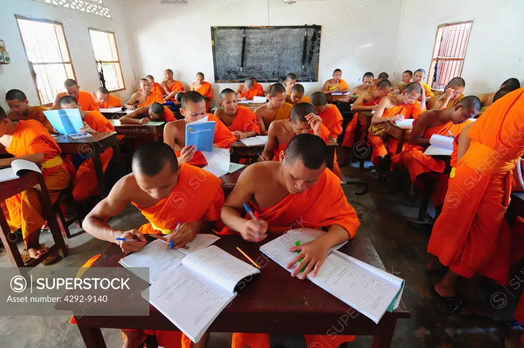 Asia, Laos, Luang Prabang, Buddhist monks in monastery classroom